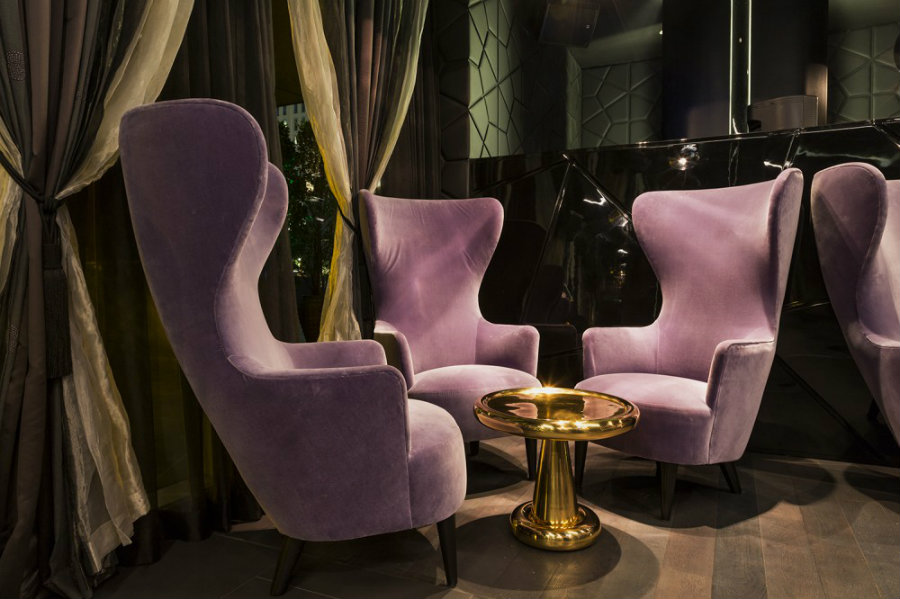 Lounge area furniture ideas with purple wingback chairs at The Cle Dubai